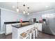 Stylish kitchen with island seating, stainless steel appliances, and sleek countertops at 4801 Daniel Mill Rd, Winston, GA 30187