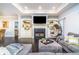 Comfortable living room featuring a fireplace, built-in shelves, and a hanging bubble chair at 4801 Daniel Mill Rd, Winston, GA 30187