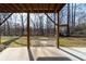 View of backyard from covered patio featuring a charming swing at 4801 Daniel Mill Rd, Winston, GA 30187