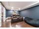 Home theater room featuring comfortable seating, a projector, and a beanbag at 4801 Daniel Mill Rd, Winston, GA 30187