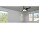 Bedroom with a ceiling fan and several windows offering bright natural light at 250 Shawnee Trl, Dallas, GA 30157