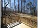 Wooden deck with railing is perfect for relaxing and taking in the landscape and beautiful outdoor space at 250 Shawnee Trl, Dallas, GA 30157