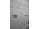 Laundry room with white wire shelf and hookups for laundry machines to make washing clothes easy at 250 Shawnee Trl, Dallas, GA 30157