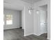 View of the interior features an open-concept living space and a modern light fixture at 250 Shawnee Trl, Dallas, GA 30157
