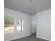 Bright living room featuring wood-look flooring and large windows that let in plenty of light at 250 Shawnee Trl, Dallas, GA 30157