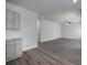 Spacious living room with an open kitchen area and modern flooring at 250 Shawnee Trl, Dallas, GA 30157