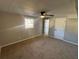 Spacious bedroom features neutral walls, carpet floors, and a ceiling fan at 2715 Heritage Ln, Morrow, GA 30260