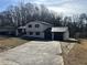 A freshly painted home with driveway and two car garage at 2715 Heritage Ln, Morrow, GA 30260