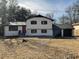 Charming two-story home with white painted brick and a well-maintained front yard at 2715 Heritage Ln, Morrow, GA 30260
