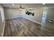 Open-concept living room with hardwood floors and view of the kitchen at 2715 Heritage Ln, Morrow, GA 30260