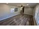 A living room area featuring luxury vinyl plank flooring and modern lighting at 2715 Heritage Ln, Morrow, GA 30260
