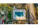 Aerial view of covered community pool, buildings and adjacent parking areas at 2678 Greentree Se Dr, Marietta, GA 30067