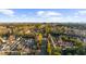 Aerial view of a quiet neighborhood with tree-lined streets and city skyline at 2678 Greentree Se Dr, Marietta, GA 30067
