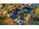 Aerial view showcases a neighborhood with homes, parking and covered community pool at 2678 Greentree Se Dr, Marietta, GA 30067