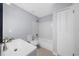 Clean bathroom featuring a bathtub, toilet and sink vanity at 2678 Greentree Se Dr, Marietta, GA 30067