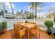 Outdoor wooden deck and dining area with seating, complemented by a well-maintained white picket fence at 2678 Greentree Se Dr, Marietta, GA 30067