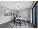 Modern dining area with gray chairs and white table at 2678 Greentree Se Dr, Marietta, GA 30067
