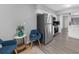 Well-lit kitchen features stainless steel appliances, gray plank flooring, and an eat-in area at 2678 Greentree Se Dr, Marietta, GA 30067