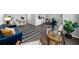 Open concept living room with blue couch and view of dining area at 2678 Greentree Se Dr, Marietta, GA 30067