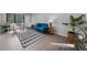 Living room featuring blue couch and patterned rug at 2678 Greentree Se Dr, Marietta, GA 30067