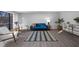Living room with blue couch and wood flooring at 2678 Greentree Se Dr, Marietta, GA 30067