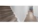 Staircase with carpeted steps and light gray walls at 2678 Greentree Se Dr, Marietta, GA 30067