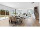 Open dining area with a large table and chairs, adjacent to the living room at 7049 Brushwood Bend (Lot 59), Lithonia, GA 30058