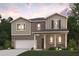 Two-story brick home with a large front porch and attached garage at 7049 Brushwood Bend (Lot 59), Lithonia, GA 30058