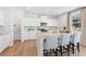 Modern kitchen with white cabinets, granite countertops and island at 7049 Brushwood Bend (Lot 59), Lithonia, GA 30058