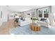 Bright and airy living room with a large sectional sofa and open floor plan at 7049 Brushwood Bend (Lot 59), Lithonia, GA 30058