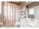 Clean bathroom with white vanity and patterned shower curtain at 110 Crestwicke Trce, Atlanta, GA 30319