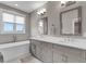 Stylish bathroom with double vanity, modern fixtures, and separate tub at 215 Arizona Ne Ave # 2, Atlanta, GA 30307