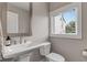 Charming powder room featuring a pedestal sink and a window with blinds at 215 Arizona Ne Ave # 2, Atlanta, GA 30307