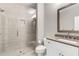 A neutral bathroom features a white vanity, taupe countertop, and glass enclosed shower at 215 Arizona Ne Ave # 2, Atlanta, GA 30307