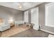 Neutral Bedroom boasts two windows, carpet floors, modern light fixture and rocking chair at 215 Arizona Ne Ave # 2, Atlanta, GA 30307