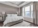 Serene bedroom with tray ceiling, large windows, and stylish gray decor at 215 Arizona Ne Ave # 2, Atlanta, GA 30307
