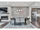 Modern dining room with contemporary lighting, fireplace, and stainless steel refrigerator at 215 Arizona Ne Ave # 2, Atlanta, GA 30307