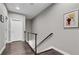 Hallway with wood floors, modern railing and white doors at 215 Arizona Ne Ave # 2, Atlanta, GA 30307