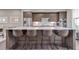 Kitchen island with white countertop and seating for four barstools at 215 Arizona Ne Ave # 2, Atlanta, GA 30307