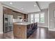 Modern kitchen with stainless steel appliances, large island with seating, and wood flooring at 215 Arizona Ne Ave # 2, Atlanta, GA 30307