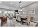 Open-concept living room with modern furnishings, fireplace, and ample natural light at 215 Arizona Ne Ave # 2, Atlanta, GA 30307