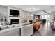 Open-concept living room with fireplace, TV, dining area, and modern kitchen at 215 Arizona Ne Ave # 2, Atlanta, GA 30307