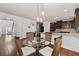 Cozy breakfast area with a glass table, wicker chairs, and easy access to the kitchen at 313 Pennant Ln, Fairburn, GA 30213