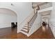 Two story foyer with hardwood floors and an elegant staircase at 313 Pennant Ln, Fairburn, GA 30213