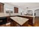 Well-appointed kitchen with dark wood cabinets, granite counters, and an open layout at 313 Pennant Ln, Fairburn, GA 30213
