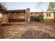 Expansive backyard showcasing brick home with covered deck at 4453 White Oak Dr, Sugar Hill, GA 30518