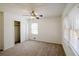 This cozy bedroom has carpet floors, neutral walls, and a closet for storage at 4453 White Oak Dr, Sugar Hill, GA 30518