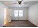 An adjacent bathroom is accessible from this neutrally decorated bedroom with carpet floors at 4453 White Oak Dr, Sugar Hill, GA 30518
