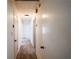 Hallway with carpet, white doors, and overhead lighting offering easy access to various areas of the home at 4453 White Oak Dr, Sugar Hill, GA 30518