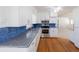 Modern kitchen with granite countertops, stainless steel appliances, hardwood floors and white cabinets at 4453 White Oak Dr, Sugar Hill, GA 30518